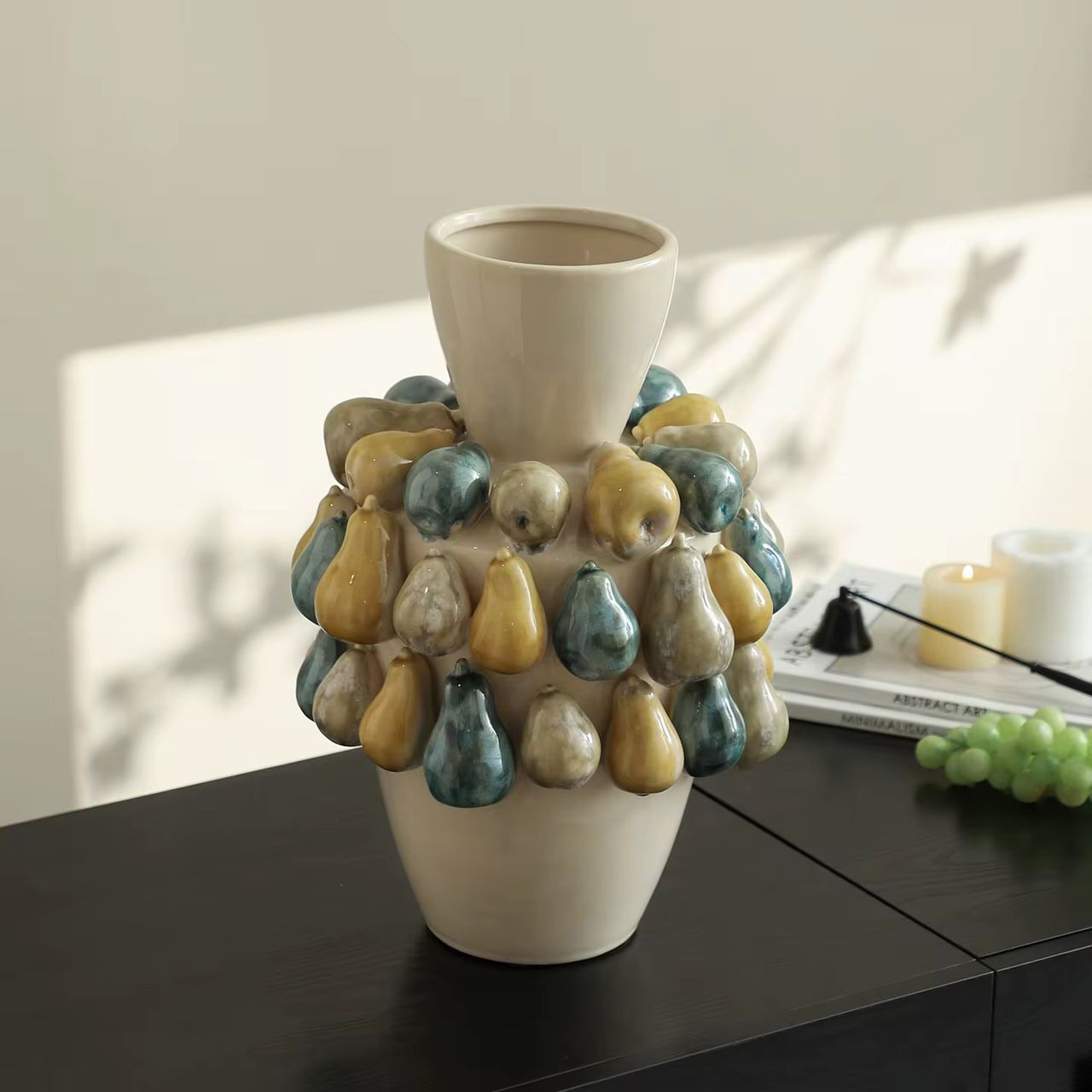 Salina Accent Vase featuring decorative pear-inspired ceramic accents and a glazed finish for modern home décor.